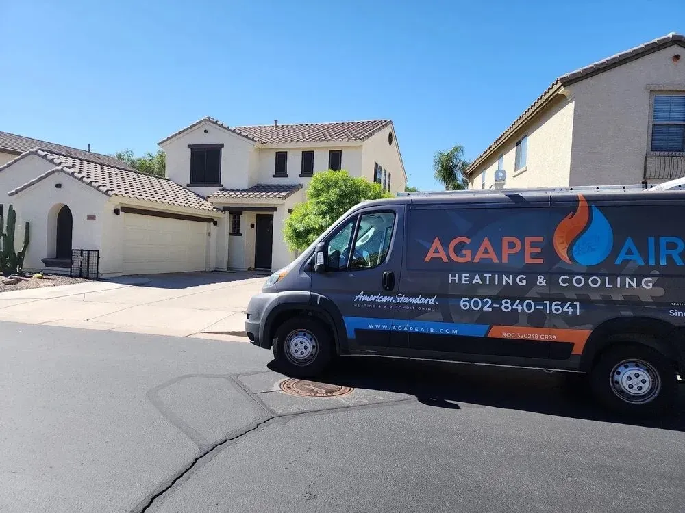 Why Seasonal HVAC Tune-Ups Are Essential 1 Residential home in Gilbert, AZ, highlighting HVAC units under hot summer conditions